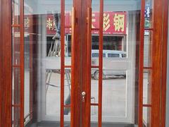 具有口碑的花梨木紋肯德基門供應商當屬蘭州鑫長城門業，海東仿銅拉絲肯德基門